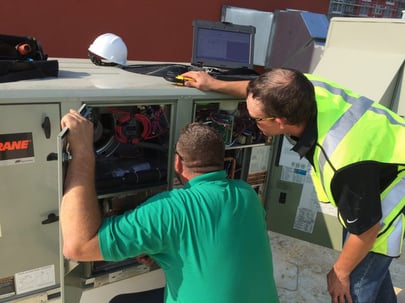 Melink technician diagnosing HVAC unit