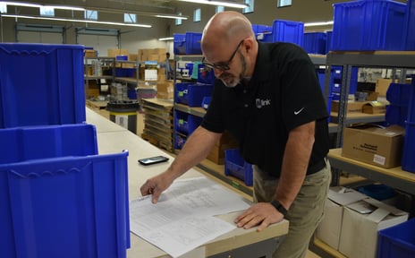 HVAC Technician reading prints for commissioning